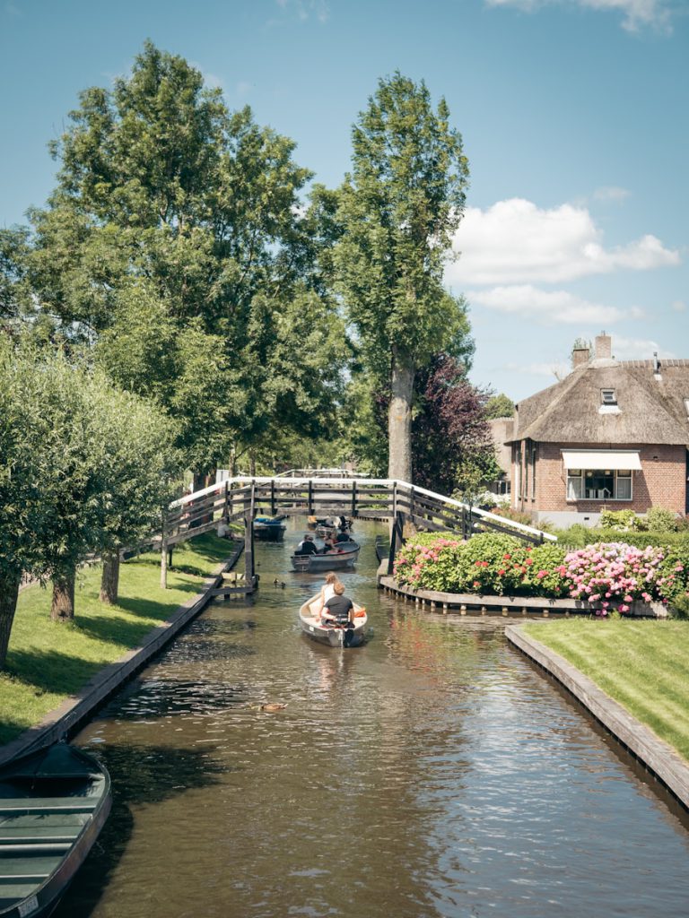 people riding on boat on river during daytime giethoorn